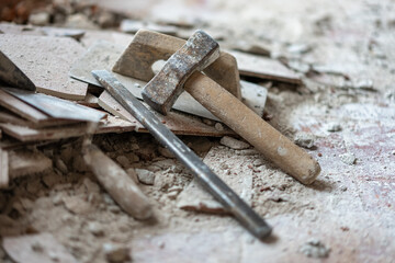 Tools for demolition of walls and floors manually with hammer and chisel.