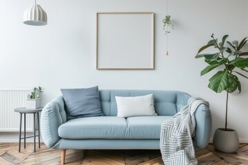 Light blue sofa in minimalist living room with empty frame.