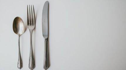 Elegant Stainless Steel Cutlery Set on White Background