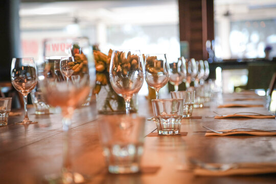 Table setting in restaurant ready for service with empty glasses