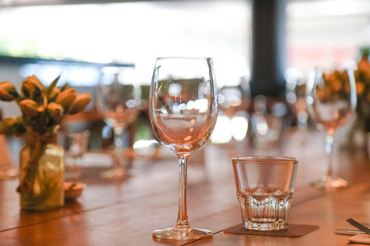 Table setting in restaurant ready for service with empty glasses