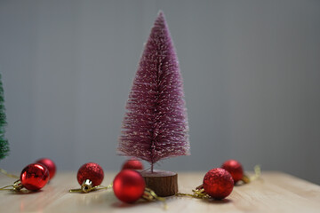 Christmas tree with festive decorations and colorful baubles in a winter holiday theme