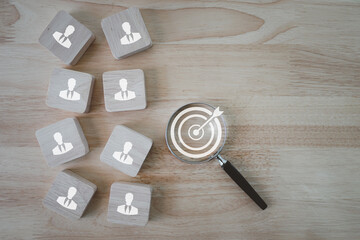 HRM or Human Resource Management, Magnifier glass focus to manager icon which is among staff icons...