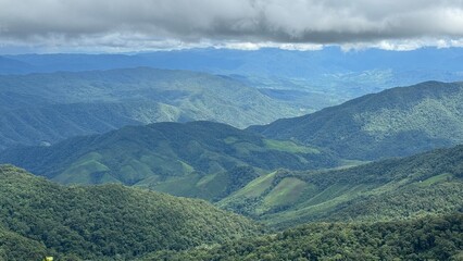 Fototapeta premium landscape of mountain layer with clouds in northern Thailand