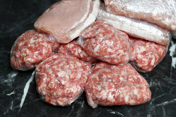 Pork slices, minced pork in plastic wrap or cling film. How to store meat concept. 