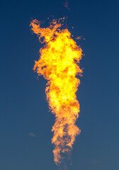 A large flame is shooting up into the sky