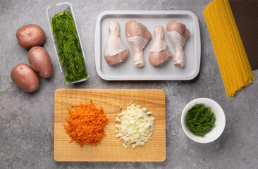 Ingredients - vegetables and meat for cooking diet chicken soup in kitchen with meal prep on wood board. Healthy and diet nutrition .Preparing for cooking.Preparing for cooking, Flat lay..