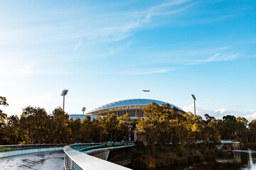 Large passenger plane flying over Adelaide Oval