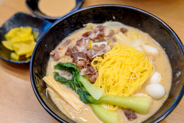 Authentic Korean Malatang Hotpot with Fresh Ingredients and Noodles in a Casual Restaurant Setting
