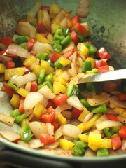 stir fried small dices of red, yellow and green bell pepper with shallots