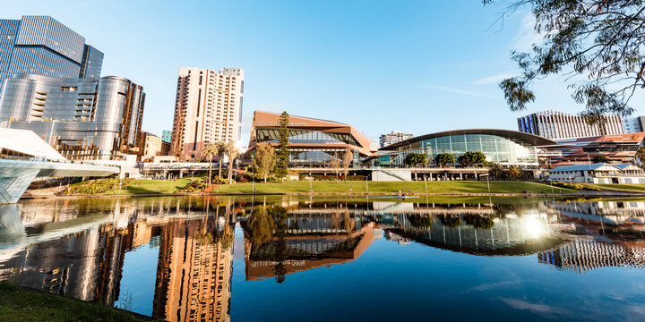 Fototapeta View of Adelaide city across the Torrens River with buildings reflected in water