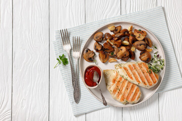 grilled chicken breasts with mushrooms, top view
