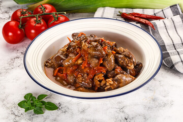 Baked chicken hearts with vegetables