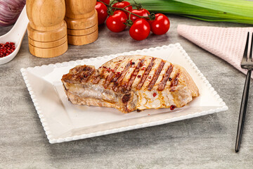Grilled pork loin steak with bone