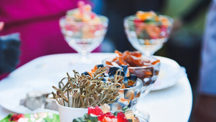 Colorful gummy candies in small glass bowls, with decorative wooden sticks, set the stage for a fun first day of school celebration