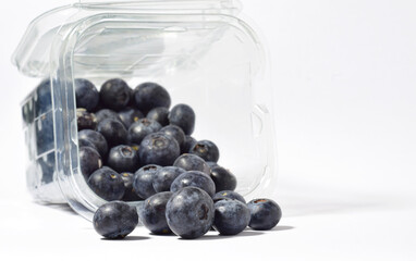 blueberries, with a contribution of beneficial nutrients for our body, white background and copy space