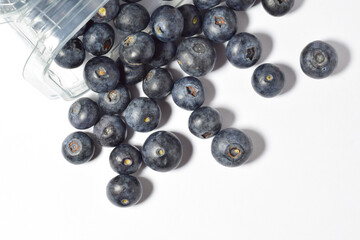 Blueberries, with a contribution of beneficial nutrients for our body, white background. Zenith view.	