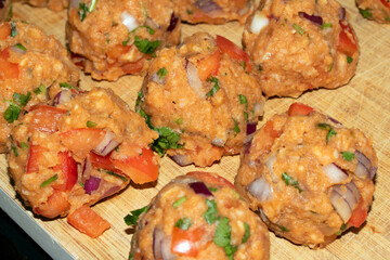 Close Up Of Golden Roasted Smashed or Crushed Potatoes on a Baking Tray