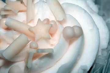 Close Up of Cupcake Cake Icing and Frosting in Chocolate with ball Decoration