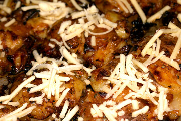 Close Up Of Golden Roasted Smashed or Crushed Potatoes on a Baking Tray