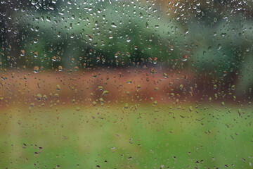 View out of a window on a rainy day with raindrops on the window