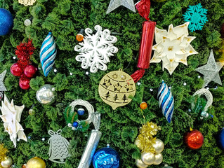 Christmas background: Christmas tree decorations on a green spruce background