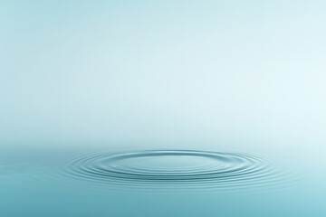 circular ripple on surface of water frozen in time displayed on gradient blue backdrop