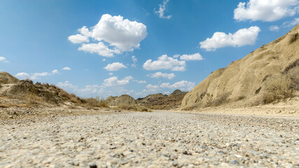 An empty road in the rocky desert.