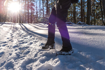 Man's legs close-up. Boot And Gaiters Of Mountaineer On The Snowy Path.