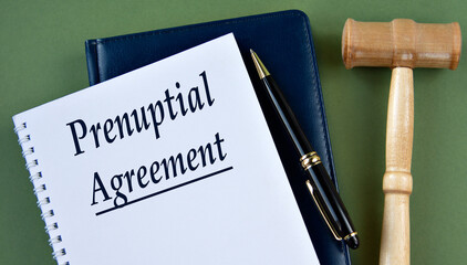 PRENUPTIAL AGREEMENT- words on a white sheet with a judge's gavel