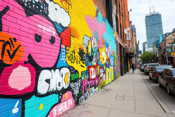 Colorful graffiti art covering a brick wall in Toronto, Canada