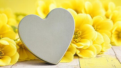 heart shaped tin with yellow flowers