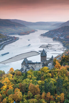 Burg Stahleck castle and river Rhine in autumn at sunrise, Rhineland-Palatinate, Germany