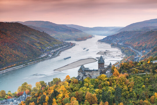 Burg Stahleck castle and river Rhine in autumn at sunrise, Rhineland-Palatinate, Germany