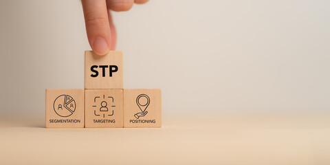 Segmentaion, targeting, positioning .STP Marketing Model. Wooden blocks with STP icons.  Identify...