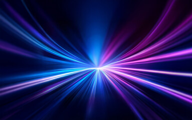 A vibrant burst of blue and purple light streaks across a dark background.  The light appears to be radiating outward from a central point, creating a sense of motion and energy.