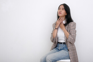 Young Indonesian woman feeling hard to breathe, suffering from a sore throat