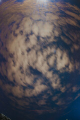 Super fisheye wide angel lens view - Cloudy Night Starry Sky With Glowing Stars. Bright Glow Of Sky Stars And Galaxy. Natural Background Backdrop