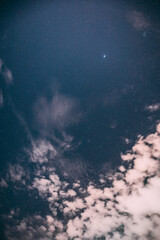 Real Night Sky Stars with some clouds cloudy sky. Natural Starry Sky Blue Color Background. unusual view natural background