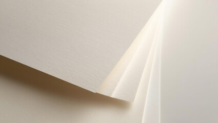 Macro of a stack of watercolor papers arranged in a fan shape, from above. For backgrounds, postcards, wallpaper