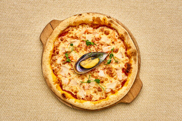 A pizza with a small shell on top of it