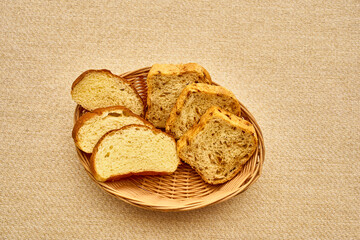 A basket of bread with a few slices missing