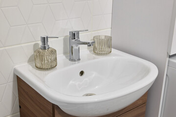 Explore a stylish bathroom sink with elegant dispensers and finishes for your home decor