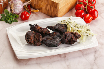 Grilled beef barbecue served onion