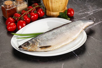 Whole raw salted herring fish