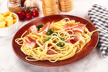 Pasta spaghetti with olives and jamon