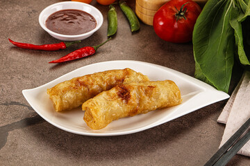 Vietnamese stuffed spring roll served sauce