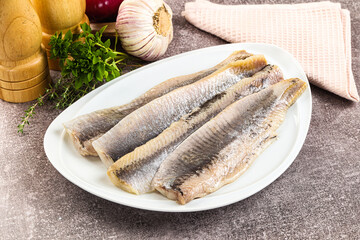 Marinated salted herring fillet apetizer