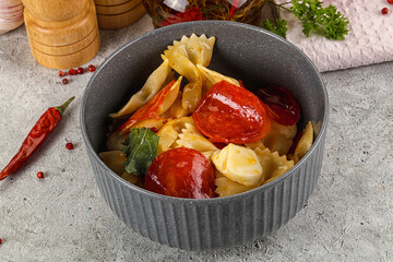 Italian pasta farfalle with pepperoni