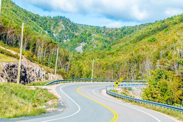 A view of zigzag bends the road on the Cabot Trail near Breton Cove, Nova Scotia, Canada in the fall